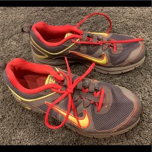 Grey, hot pink, and yellow Nike Alvord 9